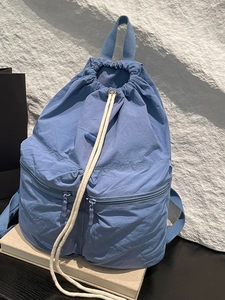 Haze blue lightweight nylon drawstring backpack with double zipper pockets and large capacity