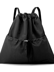 Minimalist black drawstring backpack with front pocket and adjustable straps on white background