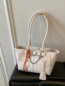 Cream white faux leather tote bag with belt buckle detail and decorative chain strap