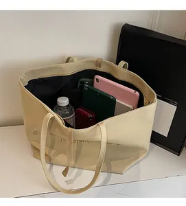 Spacious interior of beige canvas tote bag showing large capacity for daily essentials