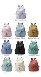 Detailed grid view showing ten available colors of the nylon backpack with bow accents