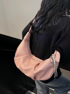 Pink pleated faux leather hobo shoulder bag with moon shape and woven charm decor