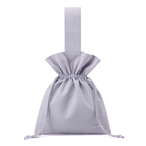 Detail of lavender nylon drawstring bag showing fabric texture and hand-held strap