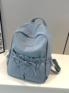 Light blue nylon backpack with ruched pockets and bow ties by Colorful Fox
