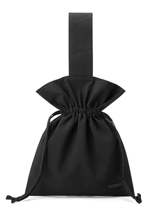 Minimalist black nylon drawstring bucket bag with ruffles and flat top handle