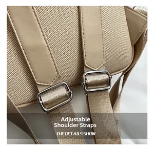 Nahaufnahme des verstellbaren Schultergurts aus Canvas mit silbernen Metallschnallen am Rucksack