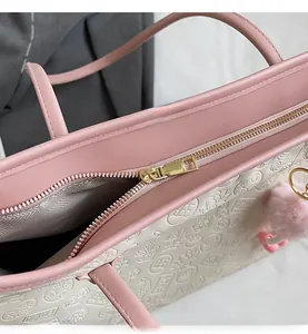 Close-up of smooth metal zipper and textured tote bag with traditional lotus patterns