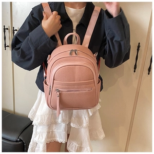 Pink niche design backpack with fine woven texture and silver zippers on a model