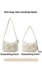 Detail of adjustable drawstring straps showing dual-way shoulder and underarm carry modes