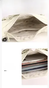 Detail view of the nylon tote bag showing internal zipper pocket and large capacity
