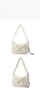 Detailed views of beige nylon tote bag with bow detail and ruched cloud shoulder strap