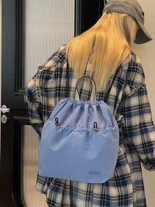 Light blue nylon drawstring backpack with large capacity for women stylish travel