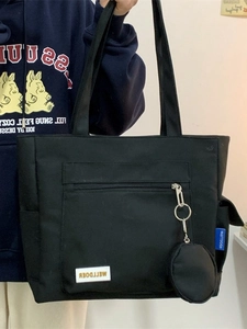 Black large capacity canvas tote bag with outer zipper pocket and round coin purse