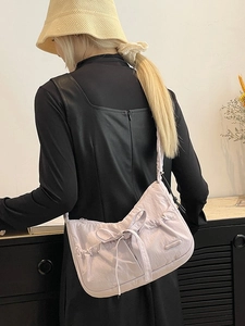 Lavender pleated nylon tote bag with large bow and shoulder strap for women