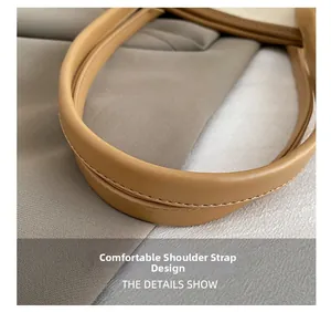 Detailed macro view of comfortable light brown leather shoulder straps with fine stitching