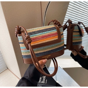 Detail of multi-color straw crossbody bag with knotted leather strap and vintage logo
