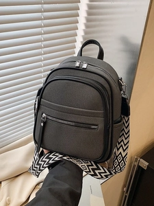 Chic dark gray canvas backpack featuring wide geometric jacquard straps and zip pockets