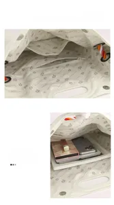 Capacité interne du grand sac cabas beige montrant compartiments et accessoires