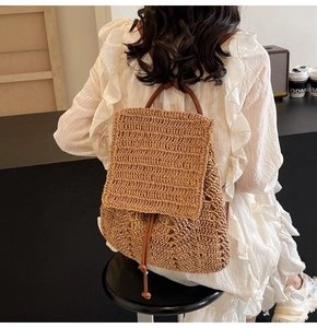 Straw backpack for women with thin leather straps shown in a cozy cafe lifestyle scene