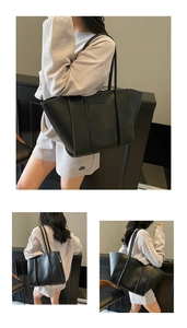 Detail of black tote bag showing white contrast stitching and minimalist FASHION lettering