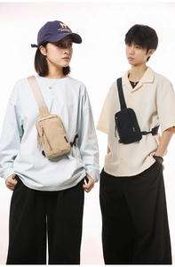 Close-up of minimalist nylon crossbody bags in khaki and black with metallic zippers