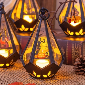 Detailed view of Halloween LED lantern with pumpkin and bat motifs in a festive setting