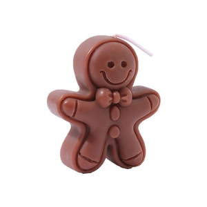 Brown gingerbread man scented candle with festive bowtie and buttons on white background