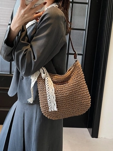 Brown woven straw hobo bag with lace floral ribbon and adjustable leather shoulder strap