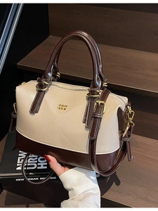Classic two-tone Boston handbag in beige and brown faux leather with gold-tone hardware