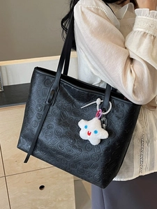 Large black PU leather tote bag with traditional embossed patterns and plush star charm