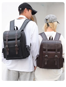 Macro shot of retro large capacity backpacks in black and brown lychee grain faux leather