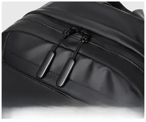 Detailed close-up of the smooth black dual metal zippers and matte waterproof fabric