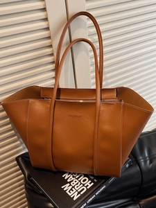 Caramel large capacity tote bag with white contrast stitching and long shoulder straps