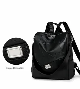 Detail of high-quality silver metal hardware on a black patchwork leather backpack