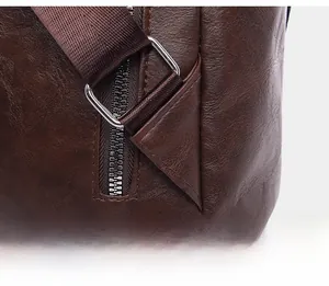 Detailed close-up of reinforced triangular stitching on leather leopard backpack strap
