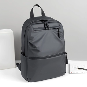 Modern charcoal grey waterproof laptop backpack with multi-pocket design for business travel