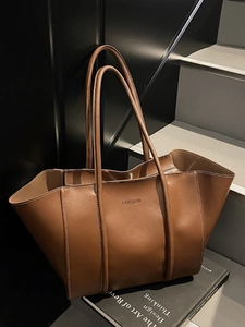 Retro caramel brown leather tote bag with contrast stitching and fashion lettering