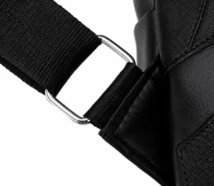 Detail of silver metal buckle and reinforced nylon strap on black leather backpack