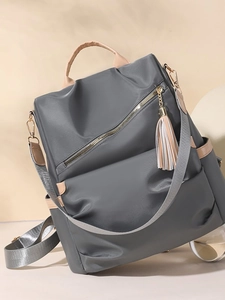 Deep gray anti-theft nylon backpack for women with stylish tassel and leather trim
