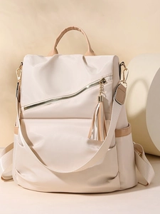 Chic beige nylon anti-theft backpack for women with stylish tassel and diagonal zipper