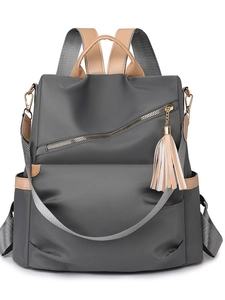 Chic dark grey anti-theft nylon backpack with leather accents and tassel detail