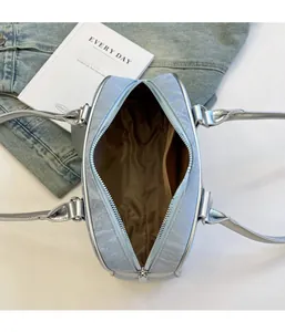 Top view of blue Boston bag showing zip closure, interior lining and inner pocket
