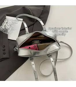 Interior view of silver Boston bag showing ample space for phone, wallet and cosmetics