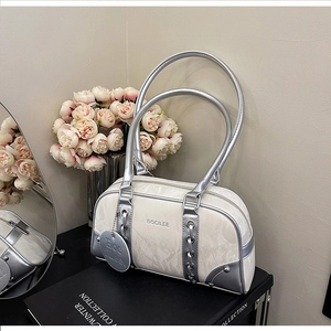 Detail of silver marble textured Boston shoulder bag with metallic eyelets and logo tag