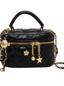 Quilted black mini chain bag with gold star charms and camellia metal hardware
