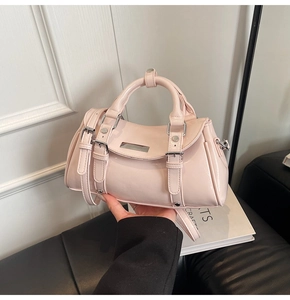 Pink patent leather Boston bag detail with silver hardware and adjustable shoulder strap