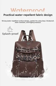 Waterproof leopard print backpack with pebbled leather texture and multi-zippered pockets
