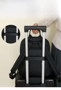 Detail of the luggage strap on a black waterproof nylon backpack for easy travel travel