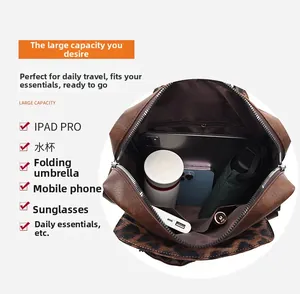 Spacious interior of leopard print backpack holding iPad, umbrella and daily essentials