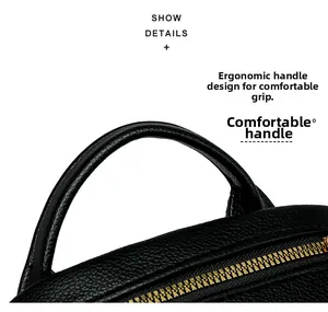 Dettaglio del manico in pelle nera della borsa e della cerniera in metallo dorato di qualità